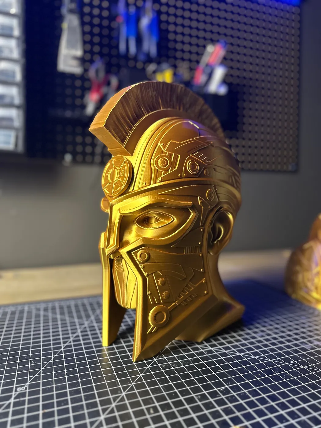 Front view of a gold 3D printed cyber Spartan helmet bust