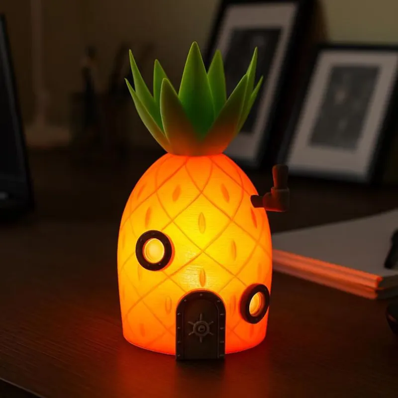 3D printed pineapple house night lamp glowing orange