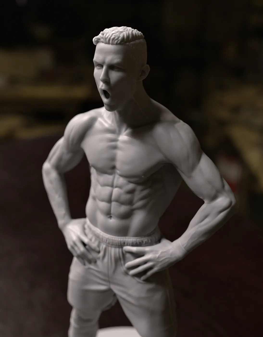 3D printed football player statue in grey resin, hands on hips