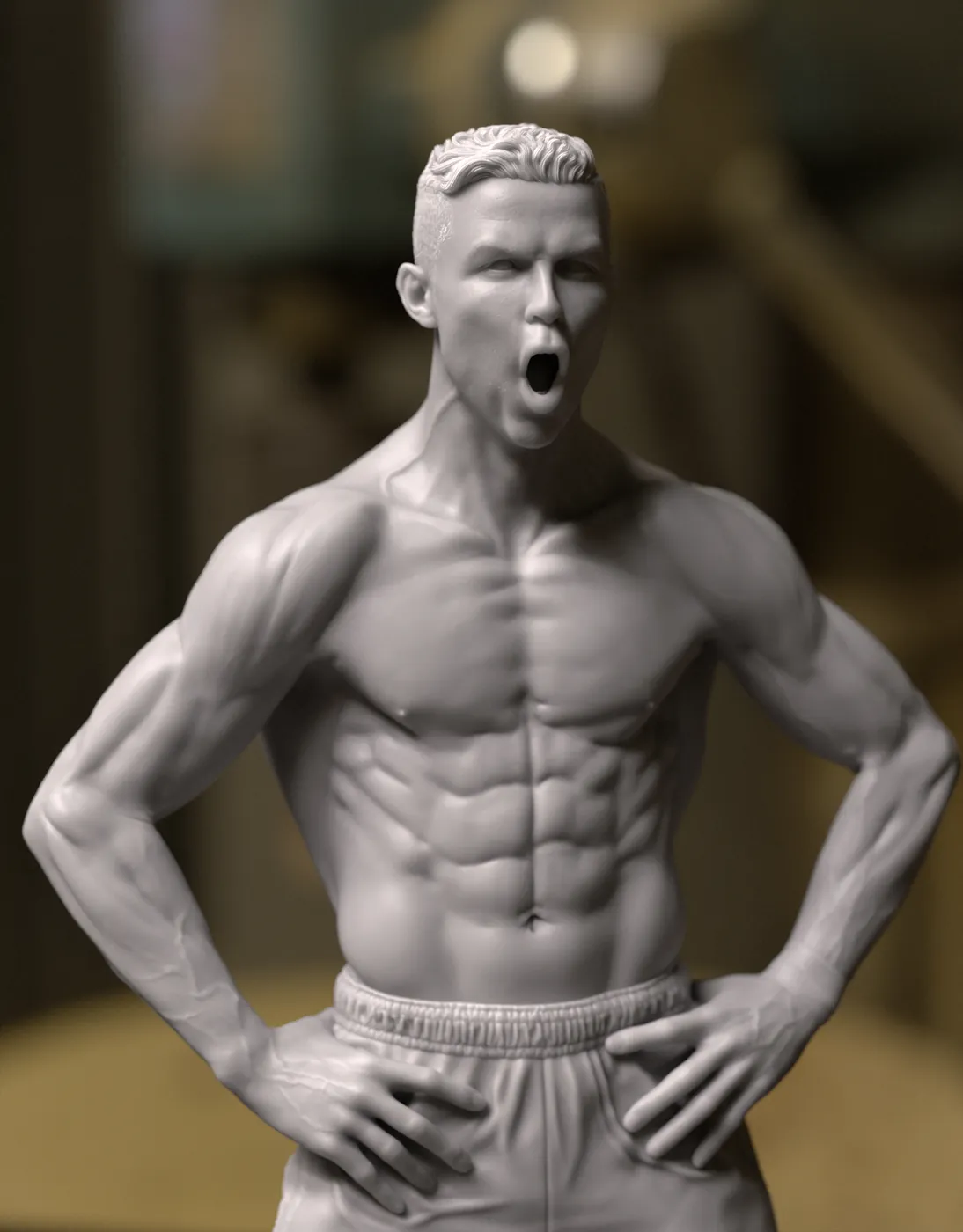 Close-up of a 3D printed football player figure celebrating, grey resin