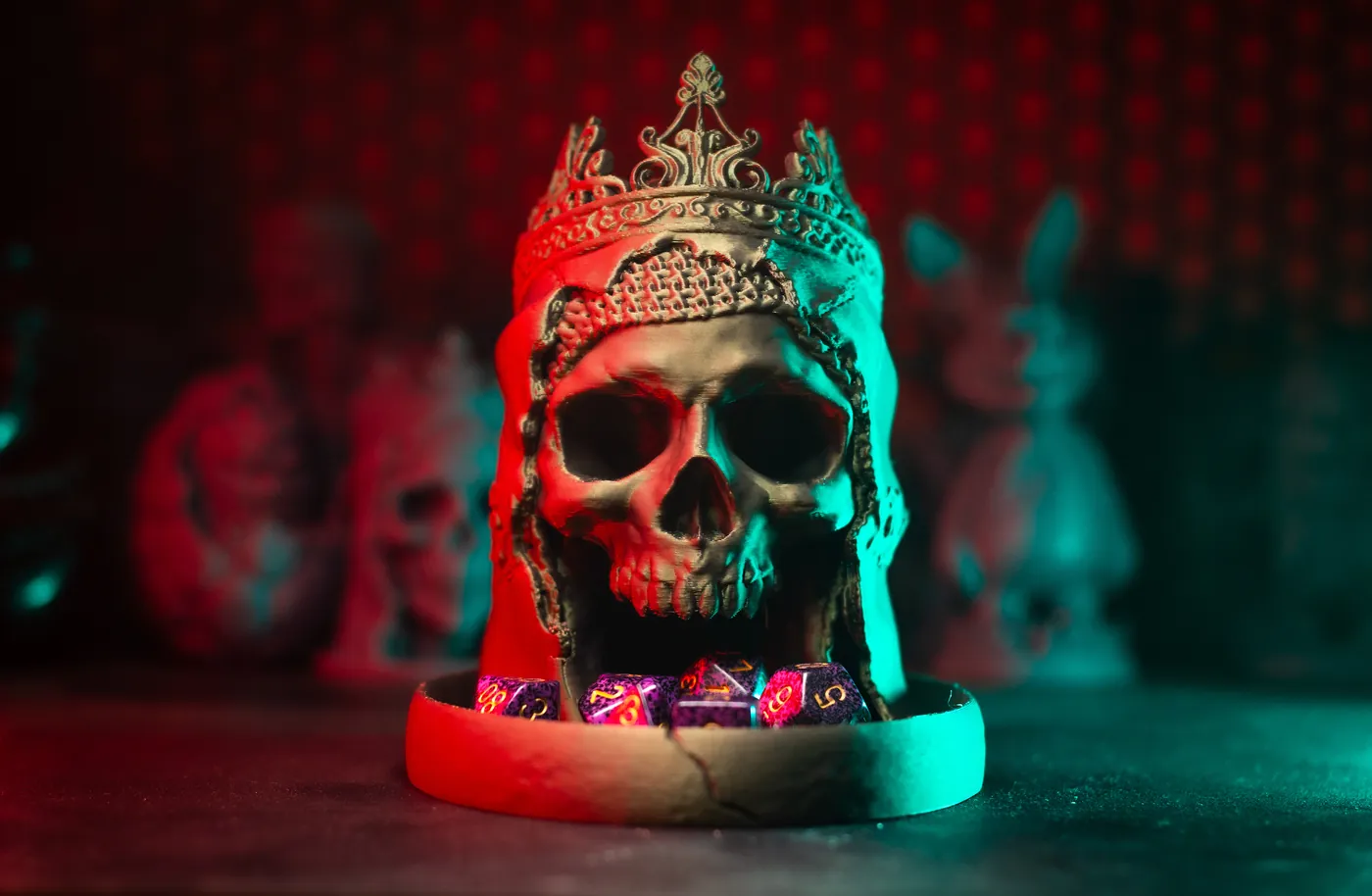 3D printed crowned skull dice tower with dice in its tray under red and teal light